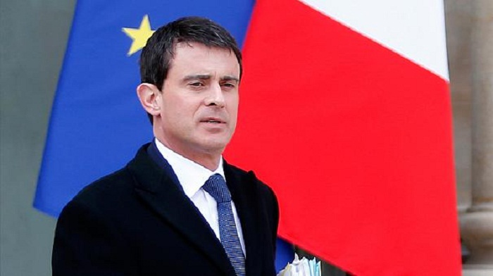French ex-PM Valls says will vote for Macron in election